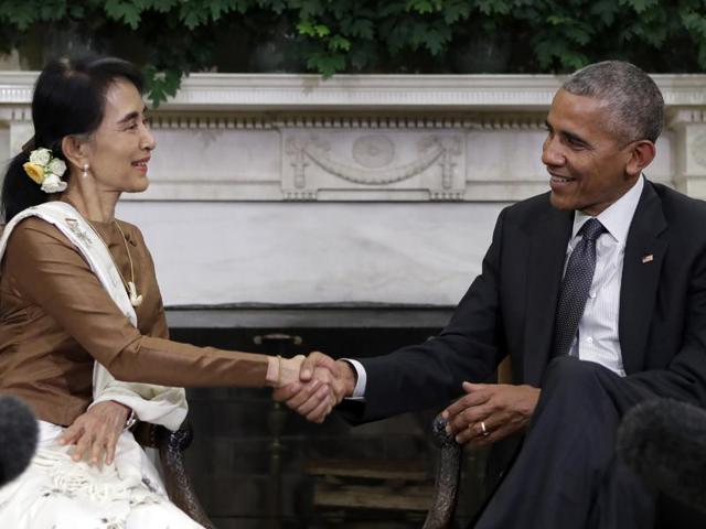 In this Sept. 14, 2016, photo, President Barack Obama and Myanmar's leader Aung San Suu Kyi shake hands as they speak to media at the conclusion of a meeting in the Oval Office of the White House in Washington. Obama on Friday lifted US economic sanctions on the former pariah state of Myanmar, the culmination of years of rapprochement that Obama has worked to facilitate. (AP file photo) In this Sept. 14, 2016, photo, President Barack Obama and Myanmar's leader Aung San Suu Kyi shake hands as they speak to media at the conclusion of a meeting in the Oval Office of the White House in Washington. Obama on Friday lifted US economic sanctions on the former pariah state of Myanmar, the culmination of years of rapprochement that Obama has worked to facilitate. (AP file photo)