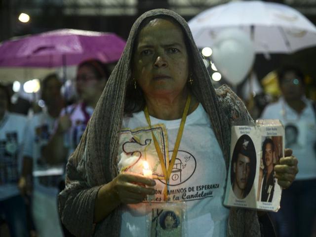 People affected by the Colombian conflict take part in a march for peace through the streets of Medellin, Colombia, on Friday just days after voters shot down a historic peace accord between the government and the Revolutionary Armed Forces of Colombia (FARC). (AFP) People affected by the Colombian conflict take part in a march for peace through the streets of Medellin, Colombia, on Friday just days after voters shot down a historic peace accord between the government and the Revolutionary Armed Forces of Colombia (FARC). (AFP)
