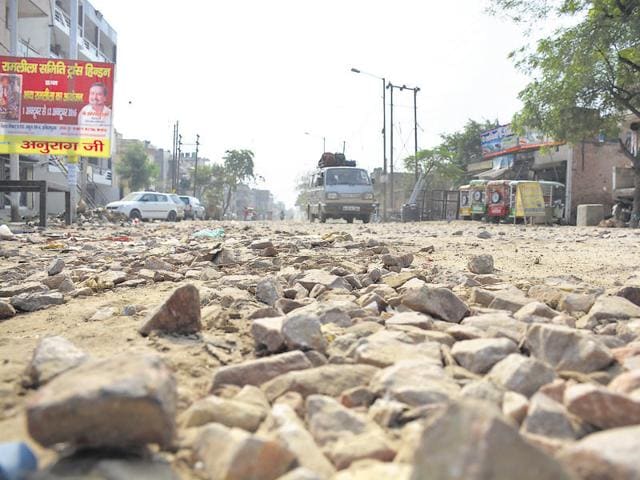 Residents say their cars have been damaged due to the potholed stretches. (Sakib Ali/HT Photo) Residents say their cars have been damaged due to the potholed stretches. (Sakib Ali/HT Photo)