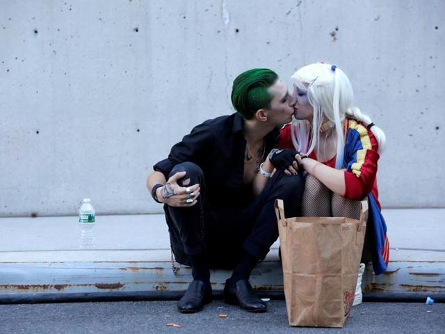 William S Hopkins, dressed as The Joker, kisses Gertrude Grussinger, dressed as Harley Quinn. (REUTERS) William S Hopkins, dressed as The Joker, kisses Gertrude Grussinger, dressed as Harley Quinn. (REUTERS)