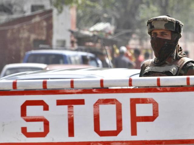 A soldier stands guard near a check post outside Badami Bagh cantonment of the army in Srinagar,on October 6, 2016. Three militants were killed in a gunfight with troops after they attacked an army camp in Langate, Handwara area of northern Kashmir's Kupwara district. This was the third such attack in recent days in Kashmir. Militants had attacked an army camp in Baramulla on October 3, 2016, killing one paramilitary soldier, while on September 18, a militant attack on an Uri army camp killed 19. (Waseem Andrabi / HT PHOTO) A soldier stands guard near a check post outside Badami Bagh cantonment of the army in Srinagar,on October 6, 2016. Three militants were killed in a gunfight with troops after they attacked an army camp in Langate, Handwara area of northern Kashmir's Kupwara district. This was the third such attack in recent days in Kashmir. Militants had attacked an army camp in Baramulla on October 3, 2016, killing one paramilitary soldier, while on September 18, a militant attack on an Uri army camp killed 19. (Waseem Andrabi / HT PHOTO)