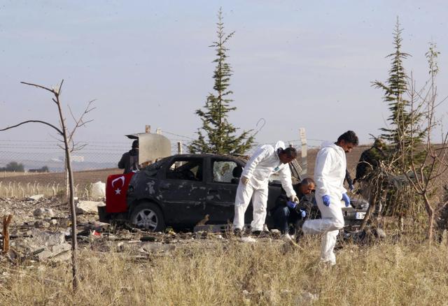 Police forensic officers work at the scene after suicide bombers blew themselves up in Haymana in the outskirts of Ankara, Turkey on Saturday. (AP) Police forensic officers work at the scene after suicide bombers blew themselves up in Haymana in the outskirts of Ankara, Turkey on Saturday. (AP)