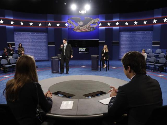 Students stand in on stage before the second presidential debate between Republican presidential nominee Donald Trump and Democratic Hillary Clinton at Washington University in St Louis. (AP) Students stand in on stage before the second presidential debate between Republican presidential nominee Donald Trump and Democratic Hillary Clinton at Washington University in St Louis. (AP)