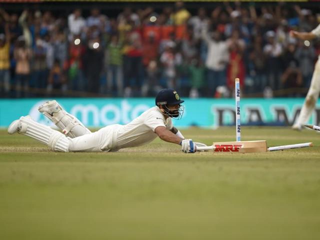 On 99, Kohli had to put in a desperate dive to avoid getting run out. (AFP) 