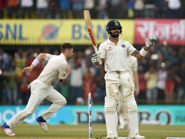 Virat Kohli celebrates reaching 100 on Saturday, his first Test ton at home since 2013. (AFP) 