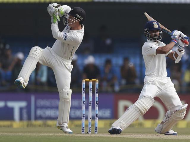 Rahane rocks off the backfoot to hit a shot as New Zealand wicketkeeper Bradley Watling follows the ball. (AP) 