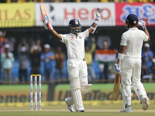 Indian batsman Ajinkya Rahane, left, celebrates his century with team captain Virat Kohli on the second day of the third Test match against New Zealand in Indore on October 9, 2016. (AP) 