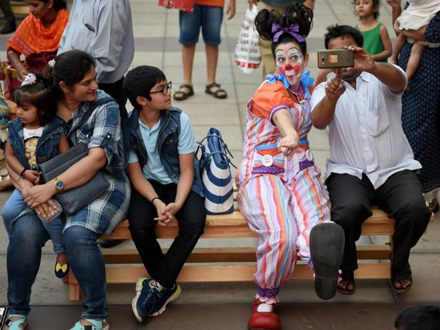 Maggie the clown poses for photos with the audience.  (Pratik Chorge/HT ) 