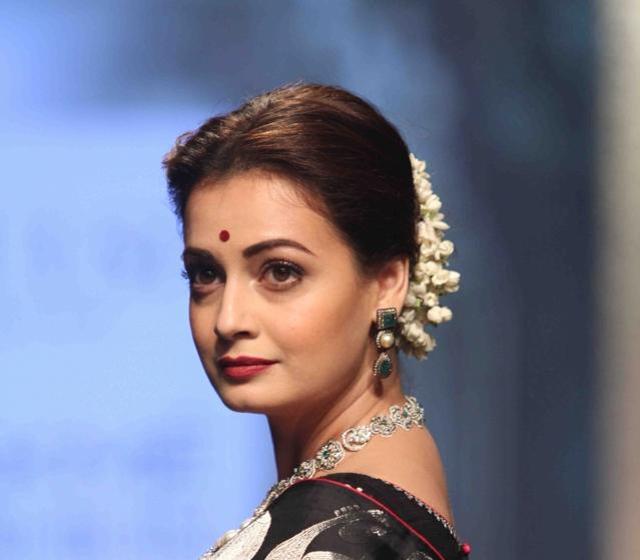 Dia Mirza displays the creation of fashion brand Tulsi Silks by fashion designer Santosh Parekh during the Lakme Fashion Week Winter Festive 2016, in Mumbai on Aug 28. (IANS)