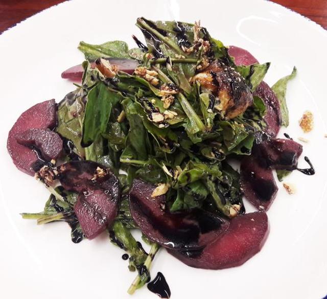 Wine flavoured poached pears tossed with star anise, arugula and olive oil by Ritwik Sarkar of Indigo Delicatessen.
