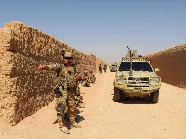 Afghan National Army commandos take position during a military operation in Helmand province. (AFP) Afghan National Army commandos take position during a military operation in Helmand province. (AFP)