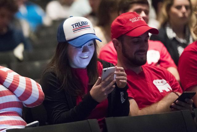Viewers react as they listen during the second presidential debate at a watch party at the University of Cincinnati on Sunday (AP) Viewers react as they listen during the second presidential debate at a watch party at the University of Cincinnati on Sunday (AP)