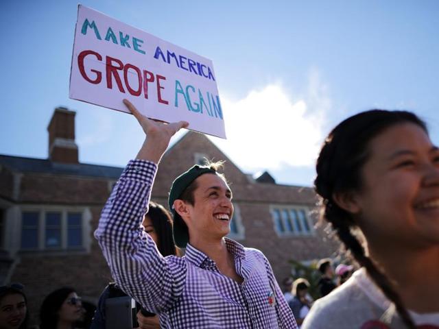 Jan Mazur of Cincinnati holds a sign before the town hall debate at Washington University. (AFP Photo) Jan Mazur of Cincinnati holds a sign before the town hall debate at Washington University. (AFP Photo)