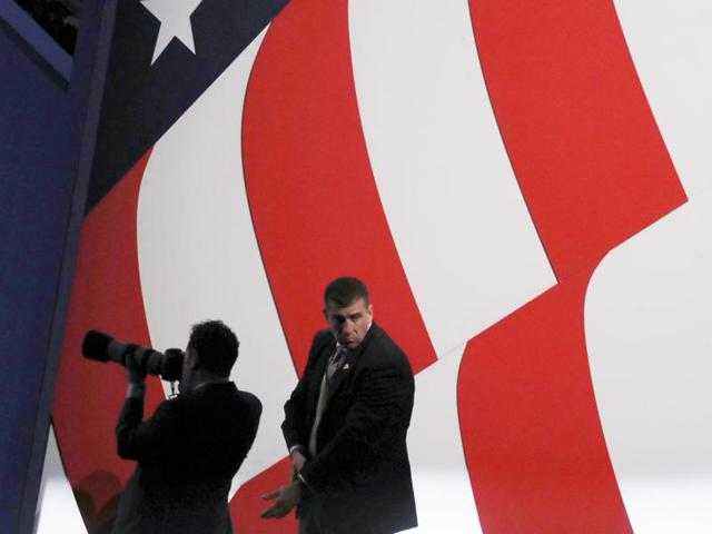 A photographer and a security personnel is seen during the second presidential debate in St. Louis, Missouri. (Reuters Photo) A photographer and a security personnel is seen during the second presidential debate in St. Louis, Missouri. (Reuters Photo)