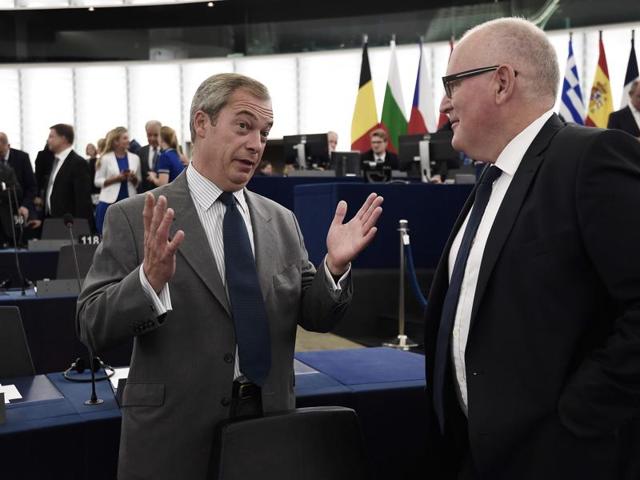 File photo of UKIP leader Nigel Farage with European Commission vice president Frans Timmermans at the European Parliament in Strasbourg.(AFP)