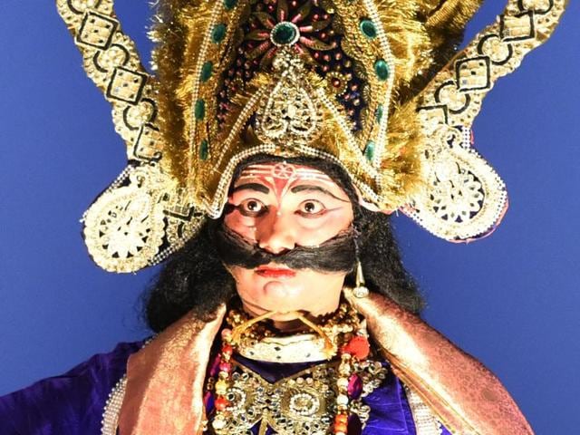 An artist, part of Raju Raj artist Shobha Yatra Shri Ramlila Committee, dresses up as Ravana, in New Delhi. (Sonu Mehta/HT Photo)