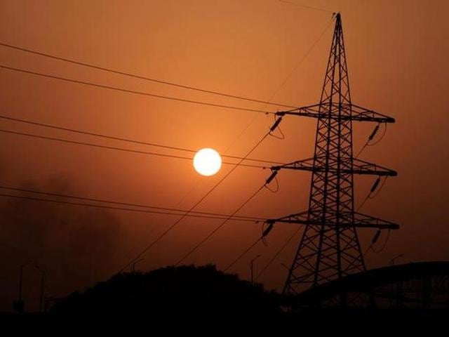 The sun sets behind a power transmission line in Rawalpindi, Pakistan. (Reuters File Photo) The sun sets behind a power transmission line in Rawalpindi, Pakistan. (Reuters File Photo)