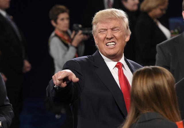 Republican US presidential nominee Donald Trump talks with a member of the audience at the conclusion of the debate. (Reuters Photo) Republican US presidential nominee Donald Trump talks with a member of the audience at the conclusion of the debate. (Reuters Photo)