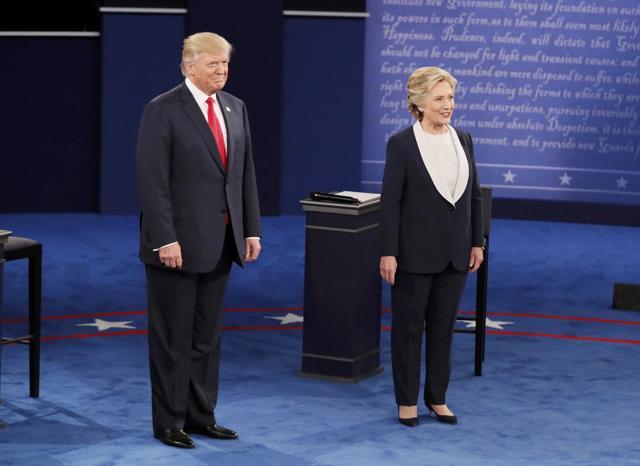Republican US presidential nominee Donald Trump and Democratic US presidential nominee Hillary Clinton enter the town hall debate at Washington University in St. Louis. (Reuters) Republican US presidential nominee Donald Trump and Democratic US presidential nominee Hillary Clinton enter the town hall debate at Washington University in St. Louis. (Reuters)
