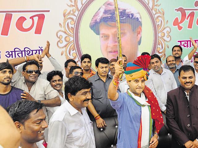 Congress MP Jyotiraditya Scindia waves a sword to his supporters at a programme of the Baghel-Pal community in Gwalior on Sunday. (HT photo) Congress MP Jyotiraditya Scindia waves a sword to his supporters at a programme of the Baghel-Pal community in Gwalior on Sunday. (HT photo)