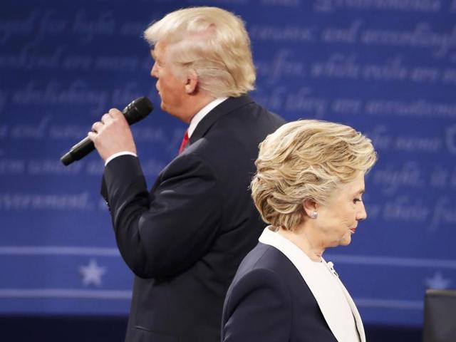 Republican US presidential nominee Donald Trump and Democratic US presidential nominee Hillary Clinton react as an audience member asks the candidates to say what they admire about each other during their presidential town hall debate at Washington University in St. Louis. (Reuters) Republican US presidential nominee Donald Trump and Democratic US presidential nominee Hillary Clinton react as an audience member asks the candidates to say what they admire about each other during their presidential town hall debate at Washington University in St. Louis. (Reuters)