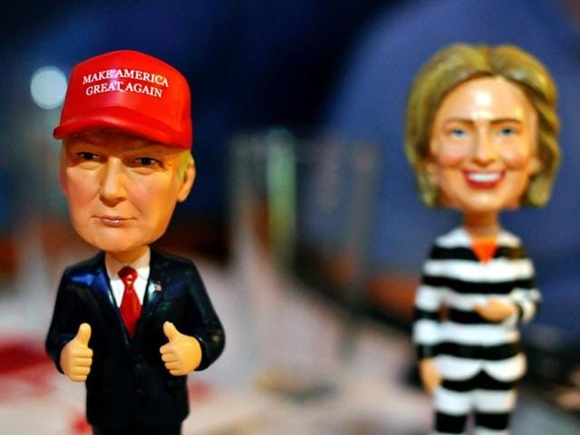 Republican US presidential nominee Donald Trump listens as Democratic nominee Hillary Clinton answers a question from the audience during their presidential town hall debate at Washington University in St. Louis, Missouri. (Reuters Photo) Republican US presidential nominee Donald Trump listens as Democratic nominee Hillary Clinton answers a question from the audience during their presidential town hall debate at Washington University in St. Louis, Missouri. (Reuters Photo)
