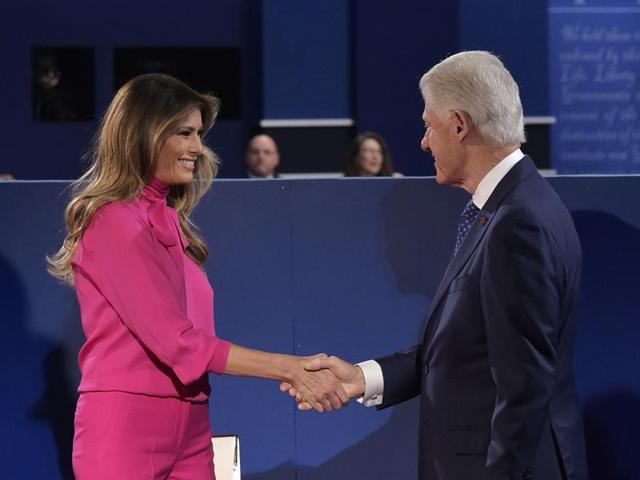 Bill Clinton checks hands with Melania Trump at Washington University. (AFP Photo) Bill Clinton checks hands with Melania Trump at Washington University. (AFP Photo)