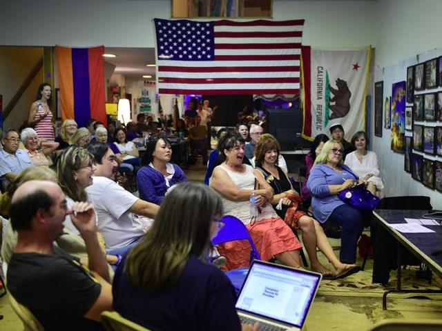 People react while watching the second presidential debate at the United Democratic Headquarters in Pasadena, California. (AFP Photo) People react while watching the second presidential debate at the United Democratic Headquarters in Pasadena, California. (AFP Photo)