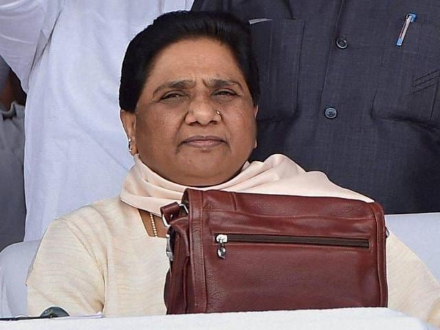 BSP chief Mayawati with party workers at a function to commemorate the tenth death anniversary of the party founder Kanshiram in Lucknow. (PTI File Photo) BSP chief Mayawati with party workers at a function to commemorate the tenth death anniversary of the party founder Kanshiram in Lucknow. (PTI File Photo)
