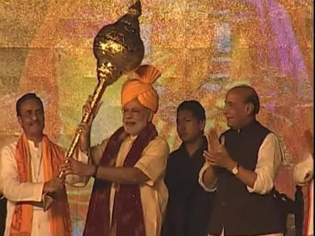 BJP's PM candidate for the 2014 elections and Gujarat chief minister Narendra Modi with retired Army chief VK Singh during Modi's rally in Rewari, Haryana. (PTI Photo) (PTI Photo) BJP's PM candidate for the 2014 elections and Gujarat chief minister Narendra Modi with retired Army chief VK Singh during Modi's rally in Rewari, Haryana. (PTI Photo) (PTI Photo)