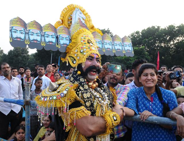 A man dressed as Ravana interacting with visitors during Dusshera celebration at Dusshera ground at sector 17 in Chandigarh on Tuesday. (ANIL DAYAL/HT) A man dressed as Ravana interacting with visitors during Dusshera celebration at Dusshera ground at sector 17 in Chandigarh on Tuesday. (ANIL DAYAL/HT)