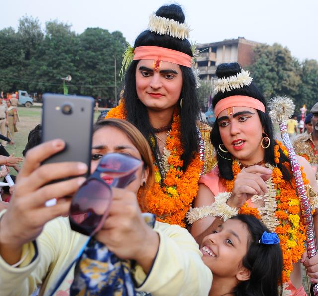 Visitors click selfies with Rama and Lakshmna during Dusshera celebration in Dushera ground at sector 17 in Chandigarh on Tuesday. (Anil DAYAL/HT) Visitors click selfies with Rama and Lakshmna during Dusshera celebration in Dushera ground at sector 17 in Chandigarh on Tuesday. (Anil DAYAL/HT)