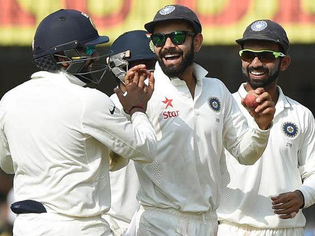 India's captain Virat Kohli (C) celebrates with teammate Ajinkya Rahane (R) and others after the dismissal of New Zealand batsman Mitchell Santner. (AFP Photo) India's captain Virat Kohli (C) celebrates with teammate Ajinkya Rahane (R) and others after the dismissal of New Zealand batsman Mitchell Santner. (AFP Photo)