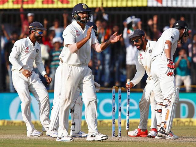 India players celebrate as Kohli rushes to pick up a stump after New Zealand’s last wicket falls. (REUTERS) India players celebrate as Kohli rushes to pick up a stump after New Zealand’s last wicket falls. (REUTERS)