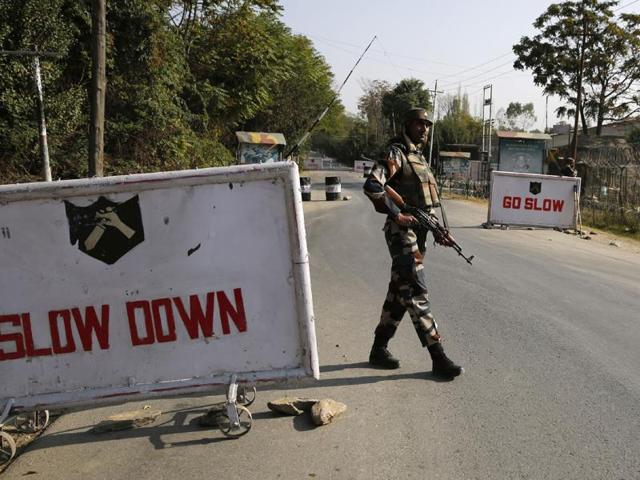 A soldier stand guard at the entrance to an army camp in Baramulla. (AFP Photo) A soldier stand guard at the entrance to an army camp in Baramulla. (AFP Photo)