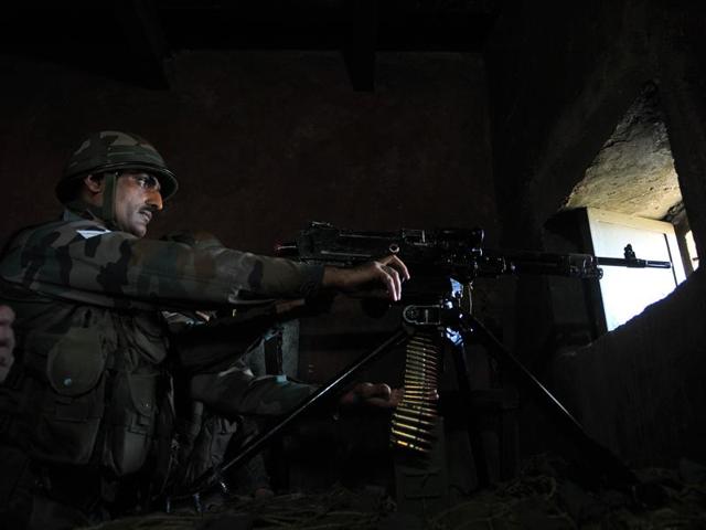 A soldier takes position near the Line of Control in Nowshera sector on Monday. (Nitin Kanotra/HT Photo) A soldier takes position near the Line of Control in Nowshera sector on Monday. (Nitin Kanotra/HT Photo)