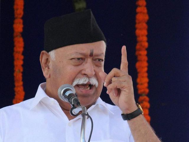 RSS chief Mohan Bhagwat, in their new uniform, with other volunteers perform shastra-pujan on the occasion of the organisation’s foundation day and Vijaya Dashami in Nagpur on Tuesday.(PTI)