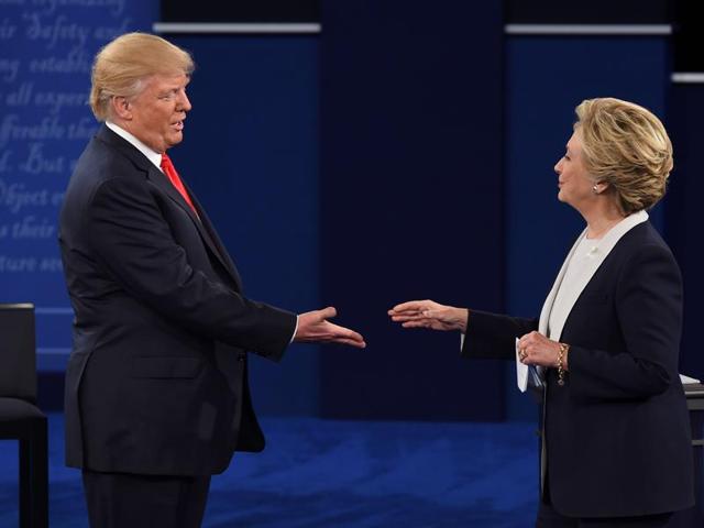 US Democratic presidential candidate Hillary Clinton and US Republican presidential candidate Donald Trump shakes hands after the second presidential debate at Washington University in St. Louis, Missouri. (AFP Photo) US Democratic presidential candidate Hillary Clinton and US Republican presidential candidate Donald Trump shakes hands after the second presidential debate at Washington University in St. Louis, Missouri. (AFP Photo)