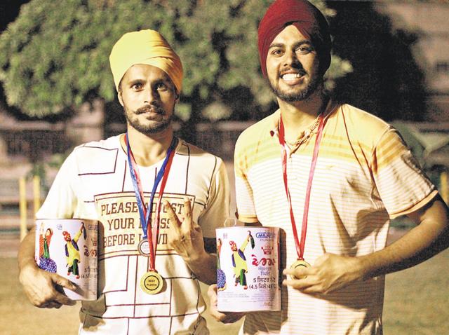 Winners of Desi Khedan games with their prize at Kila Raipur village on Tuesday.(HT Photo) Winners of Desi Khedan games with their prize at Kila Raipur village on Tuesday.(HT Photo)