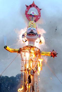 An effigy of Ravana being burnt in Chandigarh on Tuesday. (Anil Dayal/HT Photo)