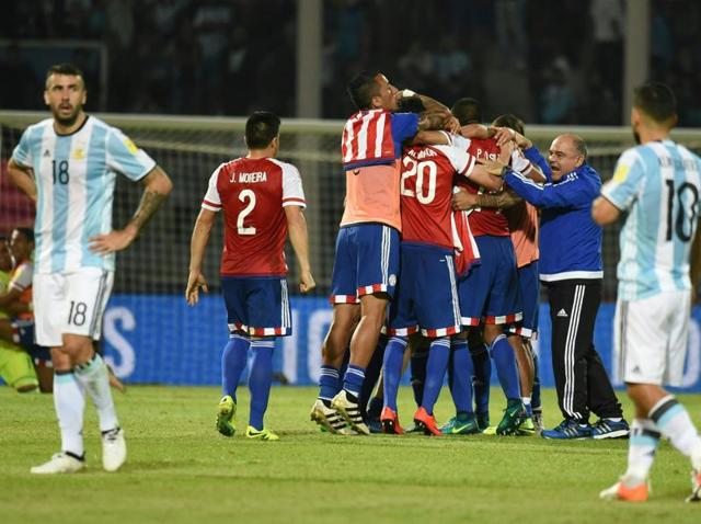 Paraguay's players celebrate their 0-1 team victory against Argentina at the end of their Russia 2018 World Cup football qualifier match in Cordoba, Argentina. (AFP Photo) Paraguay's players celebrate their 0-1 team victory against Argentina at the end of their Russia 2018 World Cup football qualifier match in Cordoba, Argentina. (AFP Photo)