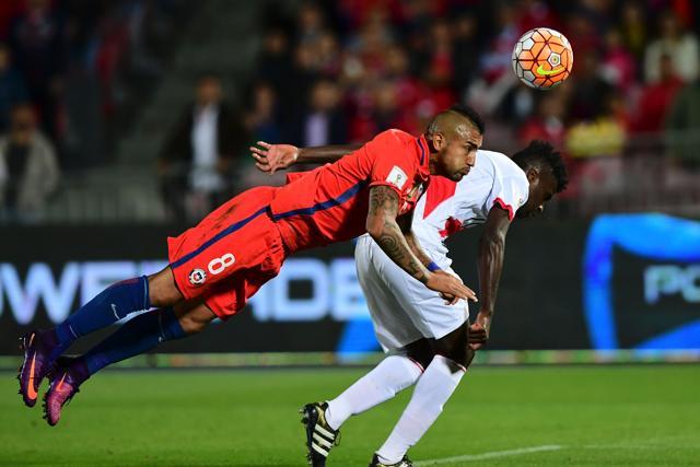 Chile's midfielder Arturo Vidal (left) vies for the ball with Peru's defender Christian Ramos during their Russia 2018 FIFA World Cup qualifier football match in Santiago. (AFP Photo) Chile's midfielder Arturo Vidal (left) vies for the ball with Peru's defender Christian Ramos during their Russia 2018 FIFA World Cup qualifier football match in Santiago. (AFP Photo)