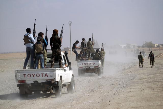Rebel fighters advancing towards Azaz city in northern Aleppo, Syria, on Tuesday. (Reuters) Rebel fighters advancing towards Azaz city in northern Aleppo, Syria, on Tuesday. (Reuters)