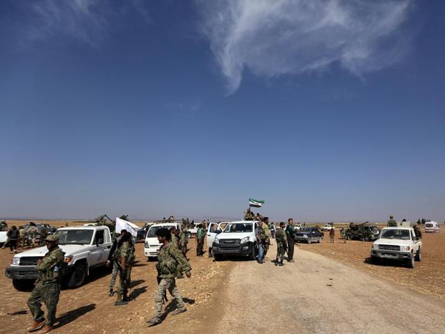 Rebel fighters pray near their weapons as they advance towards Azaz city in northern Aleppo, Syria, on Tuesday. (Reuters) Rebel fighters pray near their weapons as they advance towards Azaz city in northern Aleppo, Syria, on Tuesday. (Reuters)