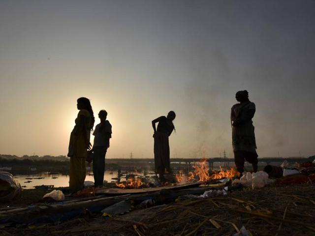 The remains of Durga Puja idols in the river Yamuna, New Delhi. (Ravi Choudhary/HT Photo)