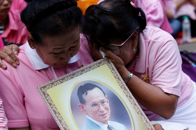 Well-wishers weep as they prays for king Bhumibol Adulyadej at the Siriraj hospital. (REUTERS) Well-wishers weep as they prays for king Bhumibol Adulyadej at the Siriraj hospital. (REUTERS)