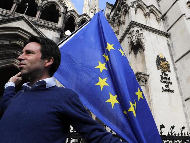 A pro-European Union supporter holds up a banner outside Britain's High Court in London on Thursday during a protest against the UK's decision to leave the EU. The battle over Britain's exit from the EU reached the High Court in a legal challenge to Prime Minister Theresa May's right to start negotiations for Britain to leave the EU without a vote in Parliament. (AFP) A pro-European Union supporter holds up a banner outside Britain's High Court in London on Thursday during a protest against the UK's decision to leave the EU. The battle over Britain's exit from the EU reached the High Court in a legal challenge to Prime Minister Theresa May's right to start negotiations for Britain to leave the EU without a vote in Parliament. (AFP)