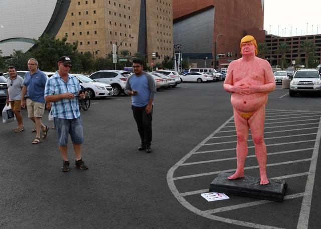 People walk by a nude statue bearing the likeness of Republican presidential nominee Donald Trump by artist Joshua Monroe in Las Vegas, Nevada. (AFP) People walk by a nude statue bearing the likeness of Republican presidential nominee Donald Trump by artist Joshua Monroe in Las Vegas, Nevada. (AFP)