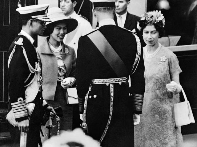 This file photo taken on July 1, 1960 shows Thai Queen Sirikit (2nd L) and King Bhumibol Adulyadej (L) being greeted by Britain's Queen Elizabeth II (R) and Prince Philip, Duke of Edinburgh, upon their arrival in London. (AFP)