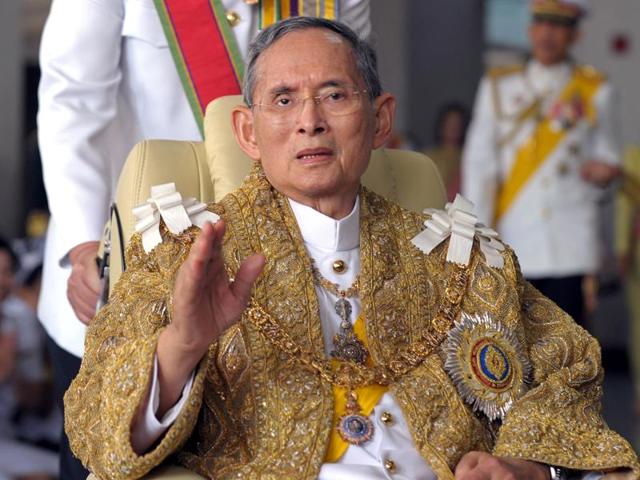 In this May 25, 2012, file photo, Thailand's King Bhumibol Adulyadej (center) is pushed in a wheelchair as he arrives at a rice field in Ayutthaya province, central Thailand. (AP) In this May 25, 2012, file photo, Thailand's King Bhumibol Adulyadej (center) is pushed in a wheelchair as he arrives at a rice field in Ayutthaya province, central Thailand. (AP)